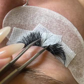 Process of Lashes being placed on client